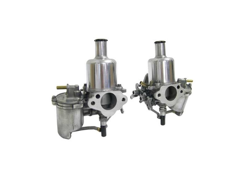 Twin carburettors on a classic car engine